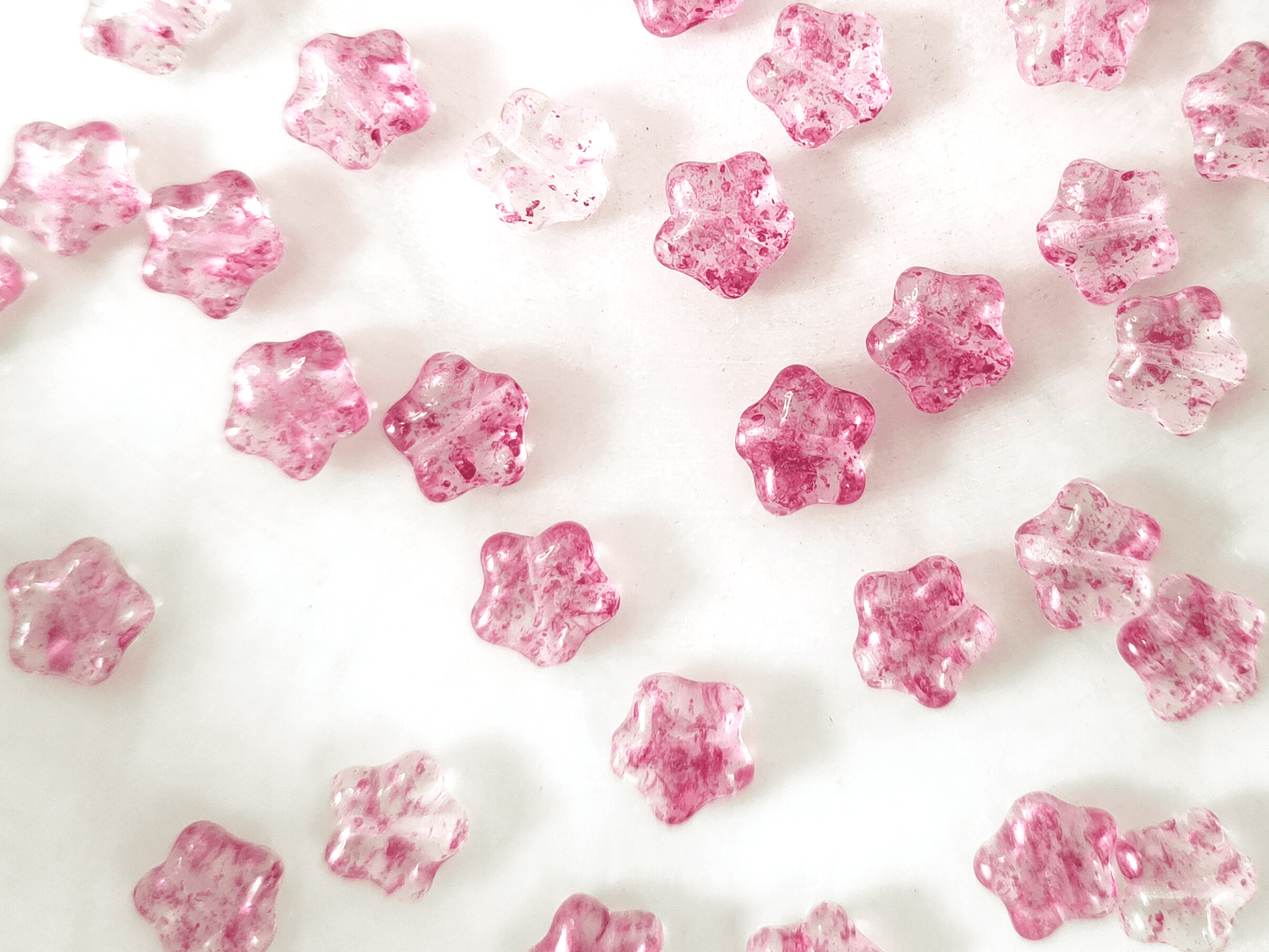 Star beads 8mm - colorless & pink speckles