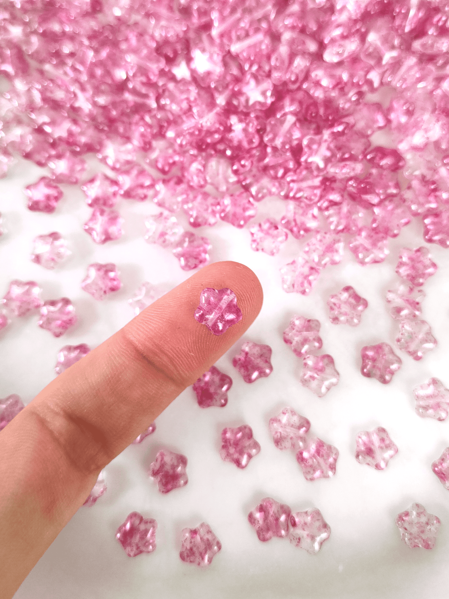 Star beads 8mm - colorless & pink speckles