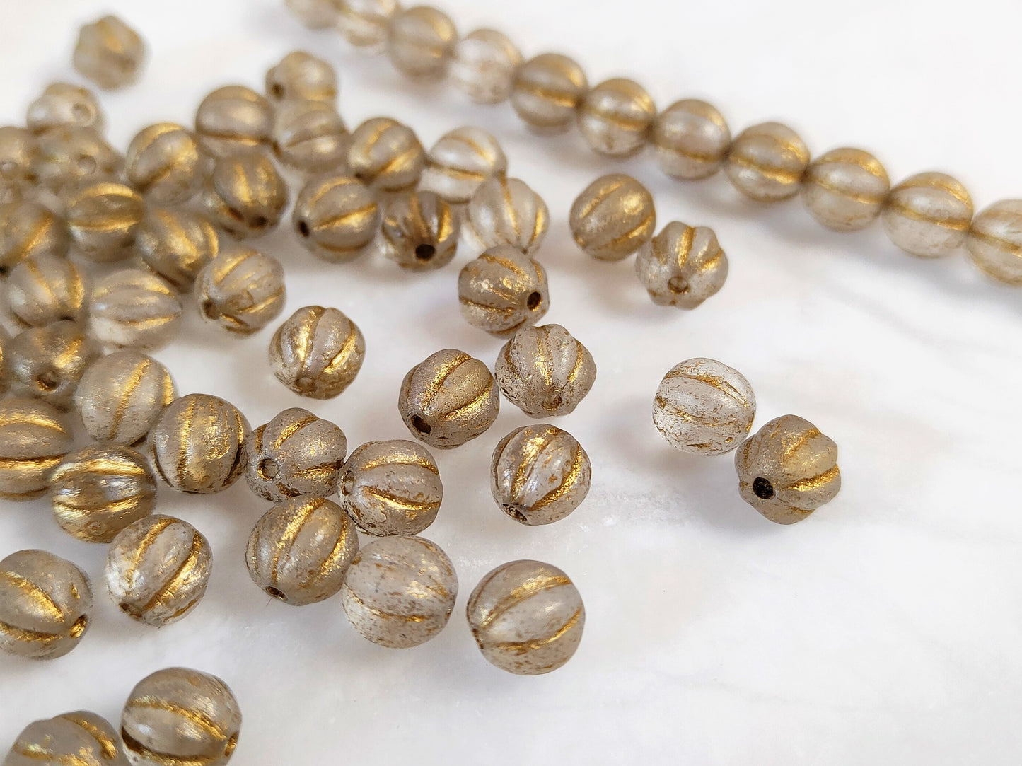 Melonen 8mm - bereift Gold