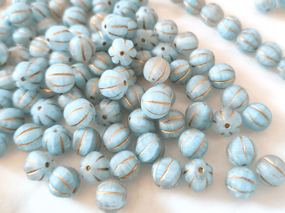 Melon beads 8mm - colorless, light blue & gold