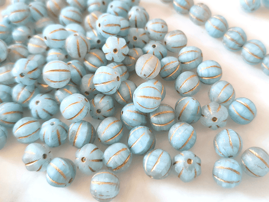 Melon beads 8mm - colorless, light blue & gold