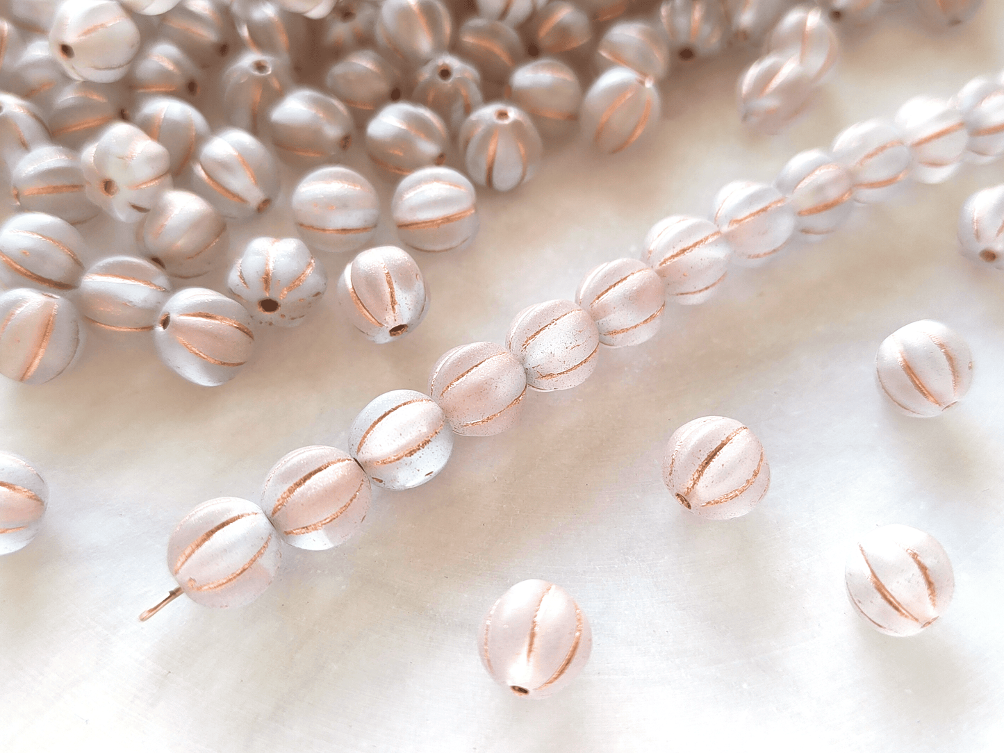Melon beads 8mm - colorless, white & copper