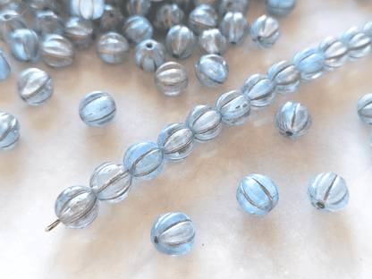 Melon beads 8mm - colorless, light blue & silver
