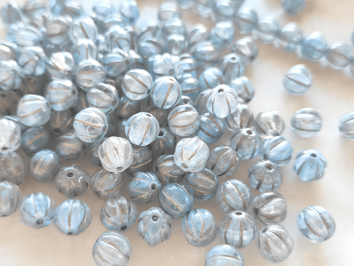 Melon beads 8mm - colorless, light blue & silver