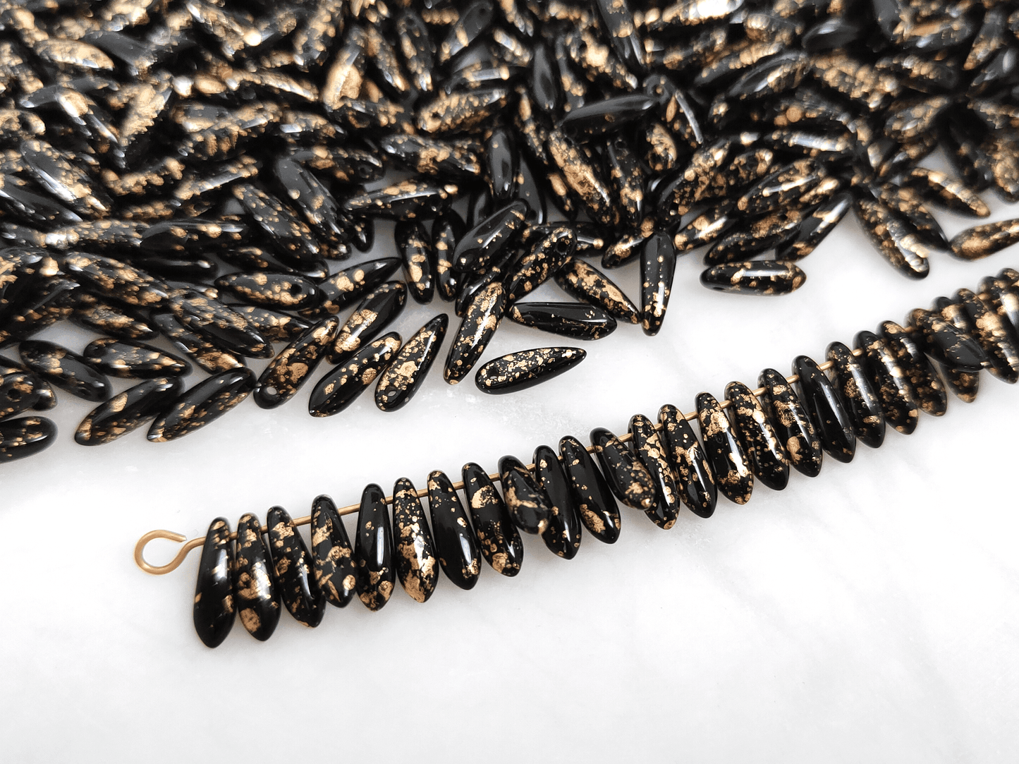 Dolche 3x11mm - Schwarz & Gold