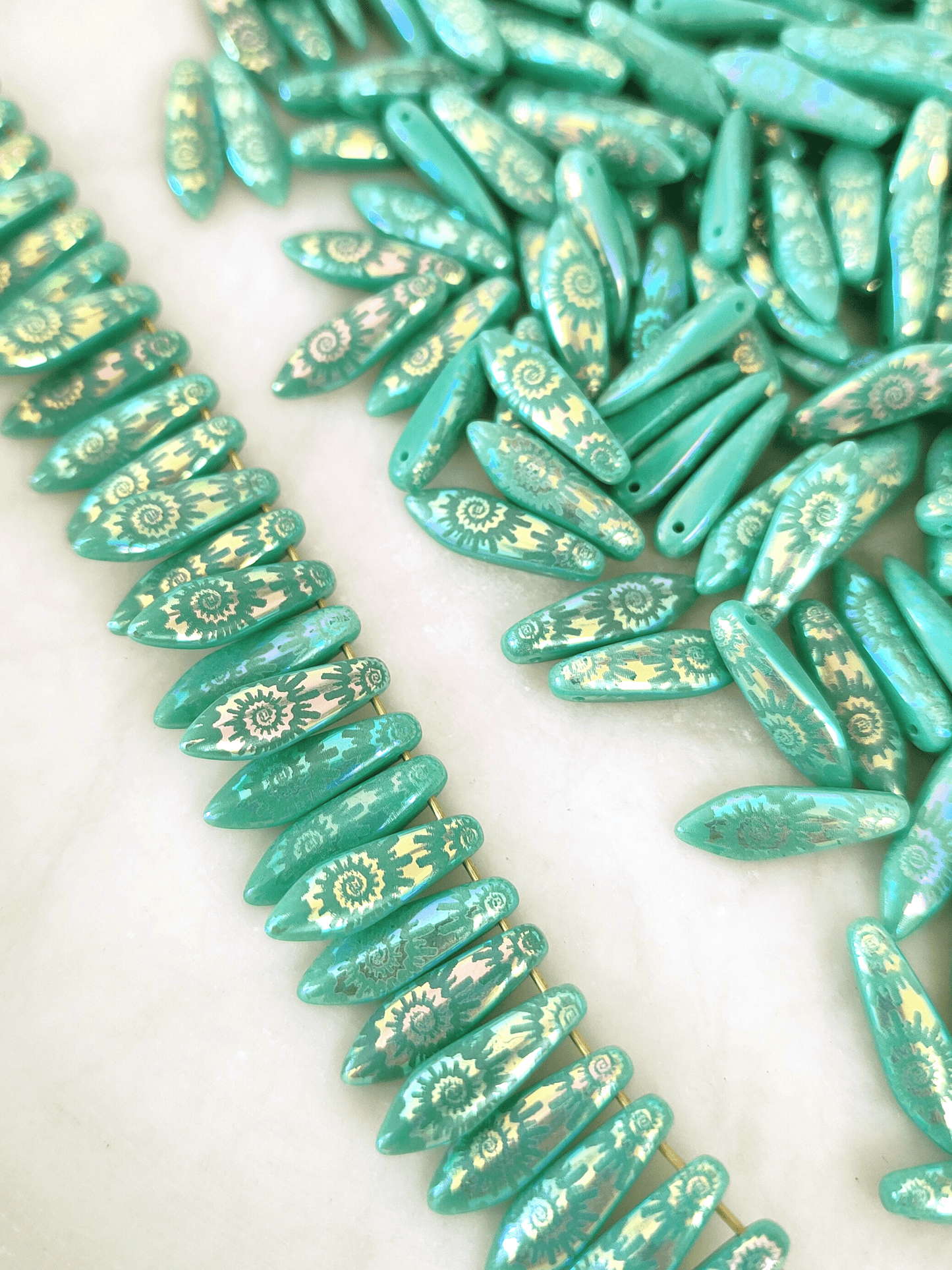 Dagger beads 5x16mm - turquoise & iris spiral motif