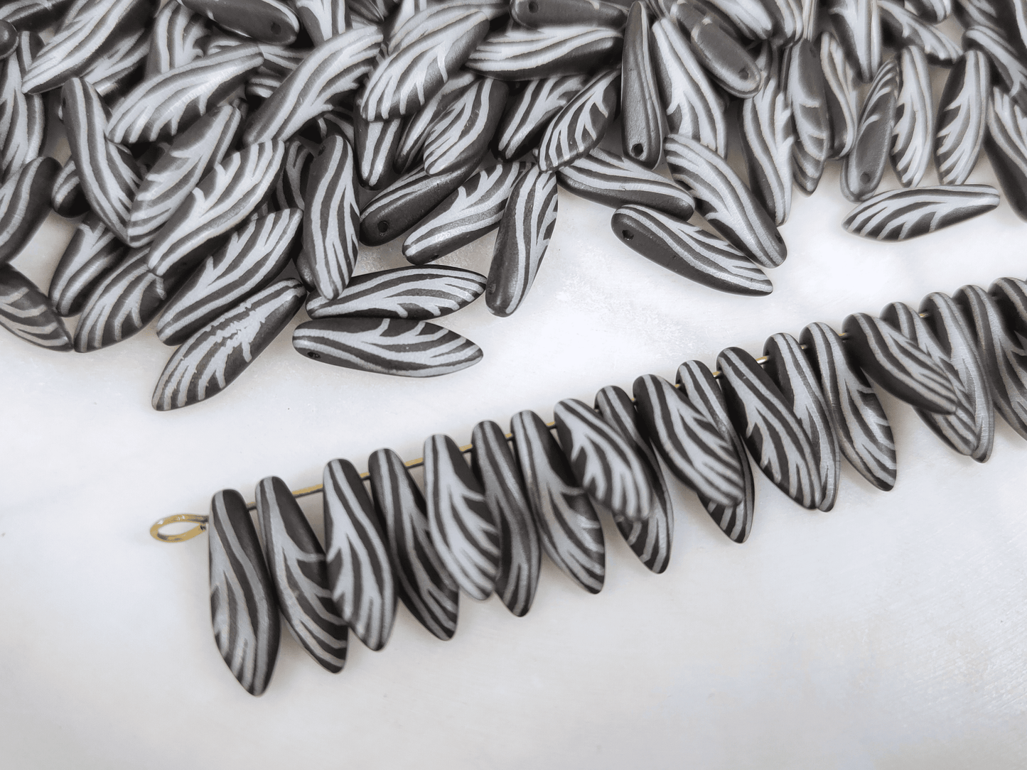 Dagger beads 5x16mm - black & insect wing motif