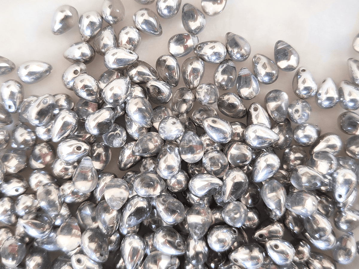 Drop beads 5x7mm - half silver