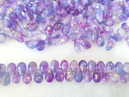 Tropfen 6x9mm - ombre Lila & Blau, Goldsprenkel