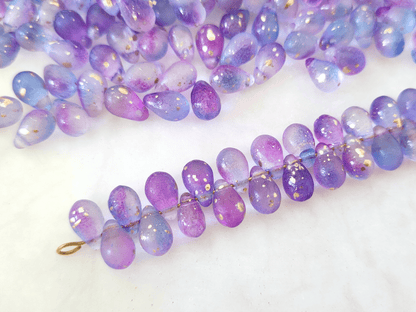 Tropfen 6x9mm - ombre Lila & Blau, Goldsprenkel
