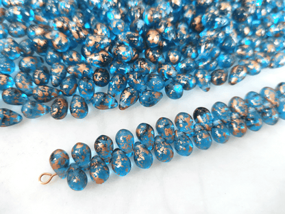 Drop beads 6x9mm - Caribbean blue & copper speckles