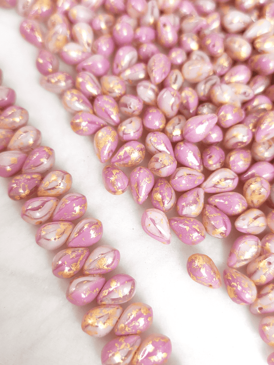 Drop beads 6x9mm - light pink & golden speckles