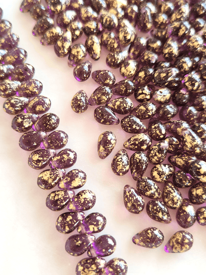 Drop beads 6x9mm - purple & golden speckles