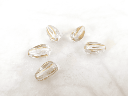 Melon drop beads 13x8mm - colorless & gold