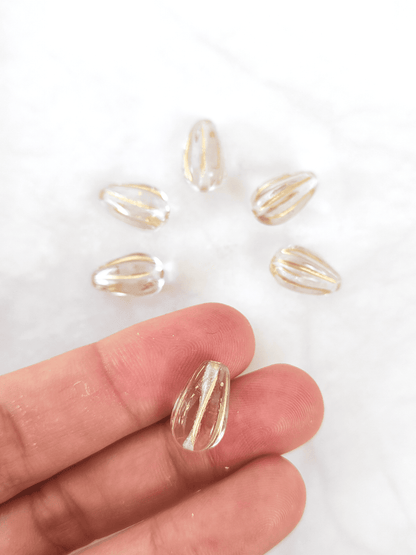 Melon drop beads 13x8mm - colorless & gold