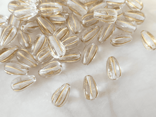 Melon drop beads 13x8mm - colorless & gold