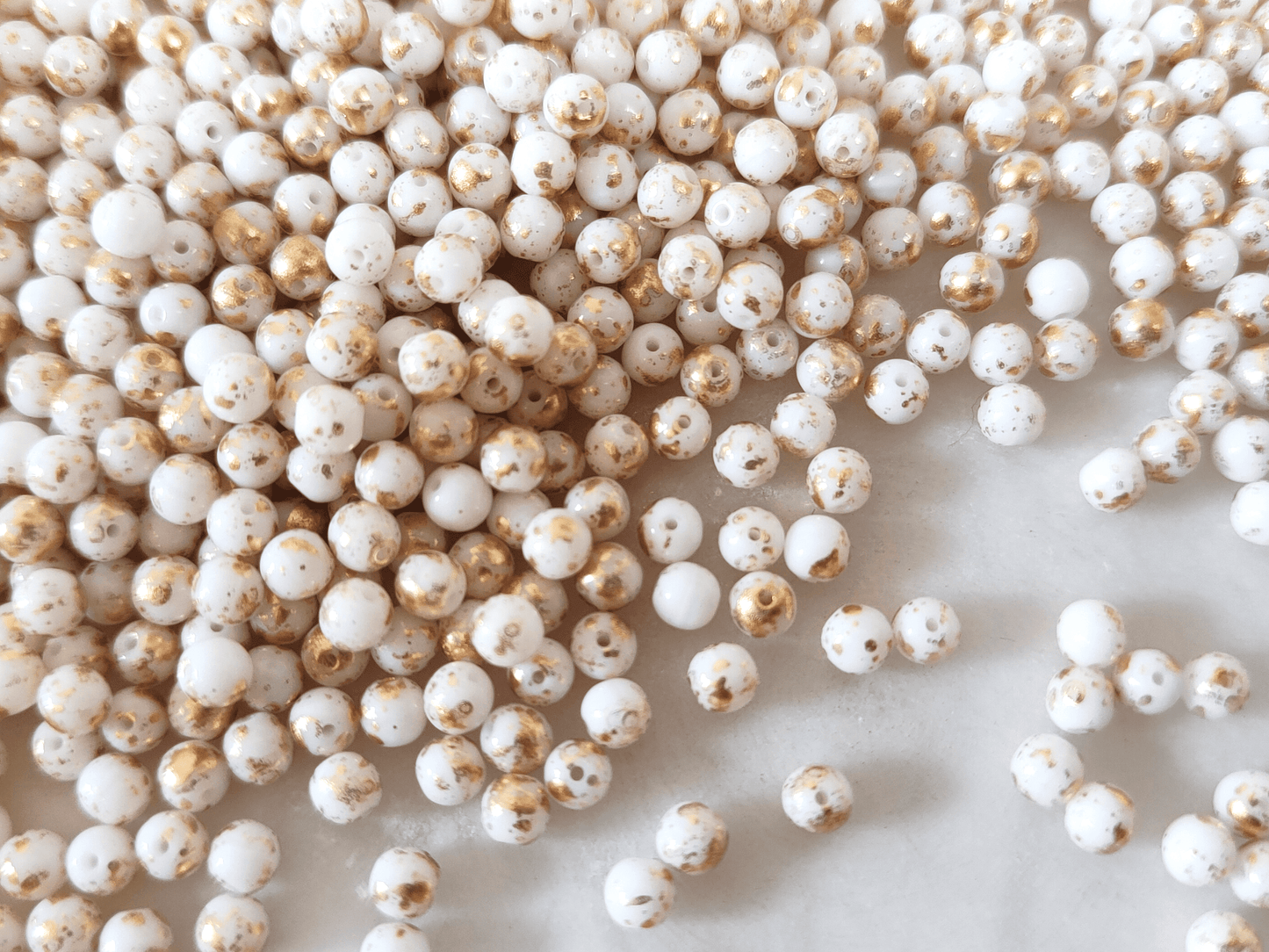 4mm round beads - white & golden speckles