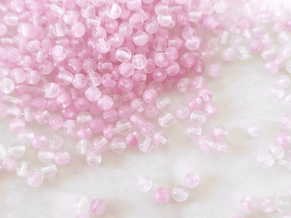 4mm round beads - colorless & light pink