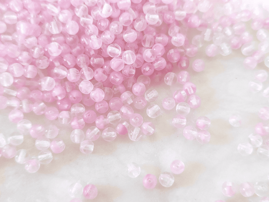 4mm round beads - colorless & light pink