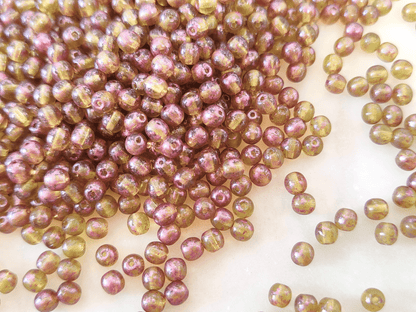 4mm round beads - green & purple speckled