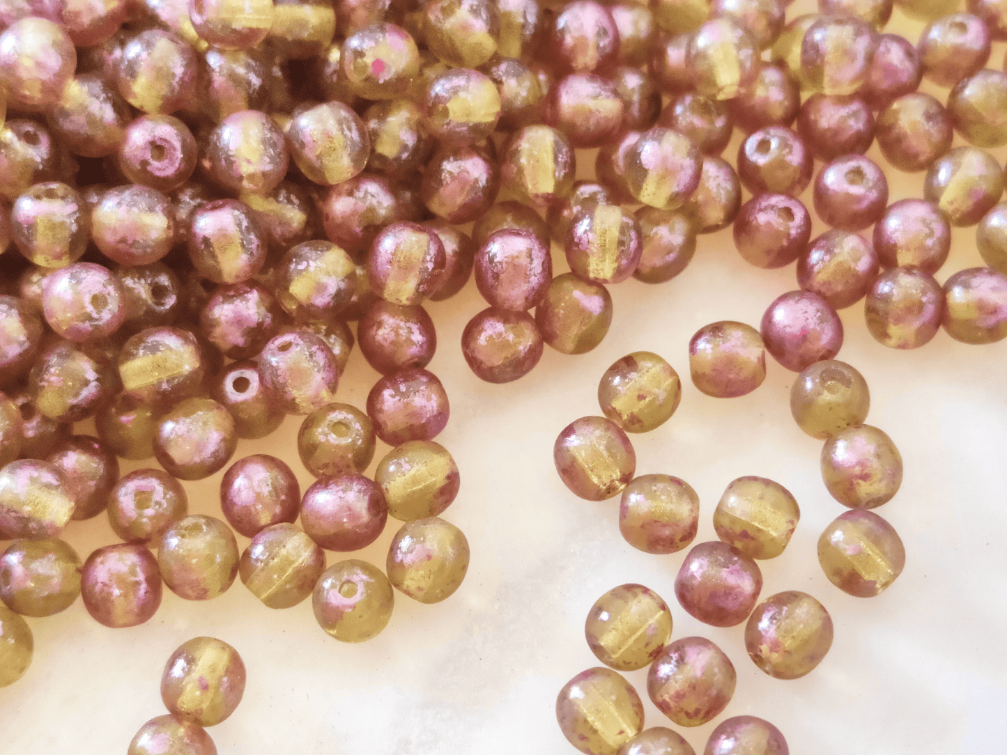 4mm round beads - green & purple speckled