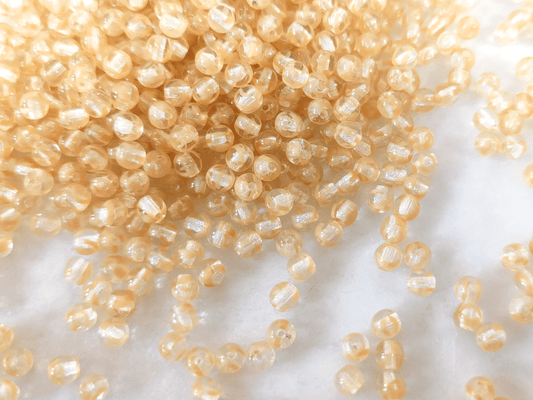 4mm round beads - colorless & beige