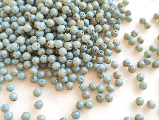 4mm round beads - light blue Picasso