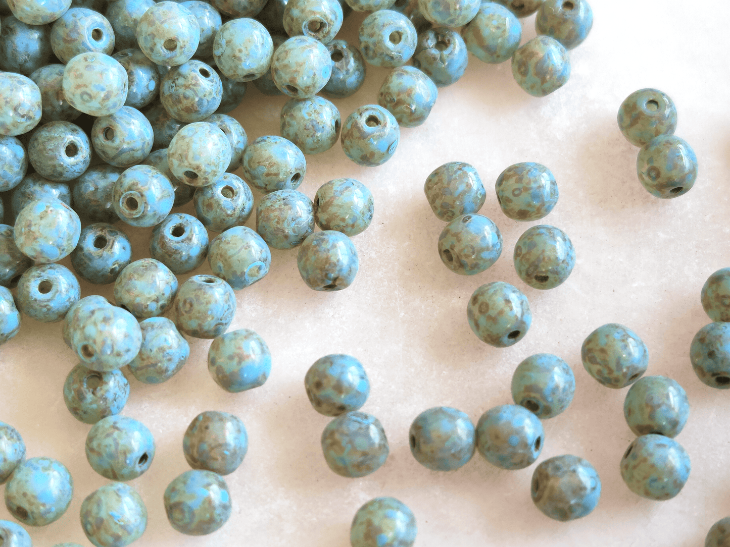 4mm round beads - light blue Picasso