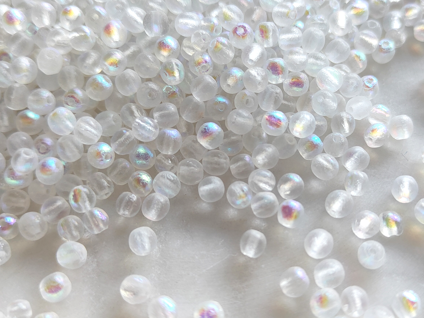 4mm round beads - frosted white iris