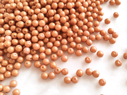 4mm round beads - shiny orange luster