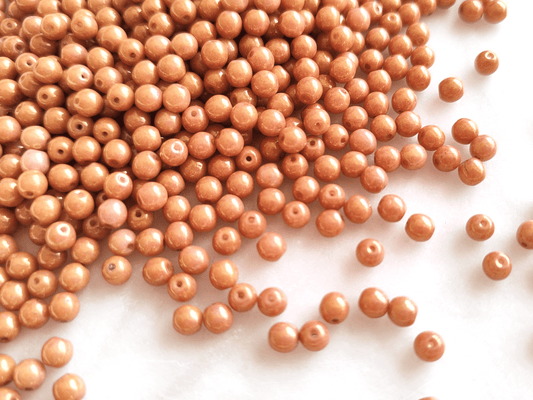 4mm round beads - shiny orange luster