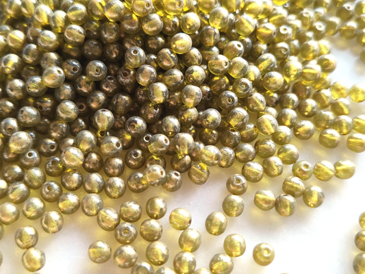 4mm round beads - colorless & gold