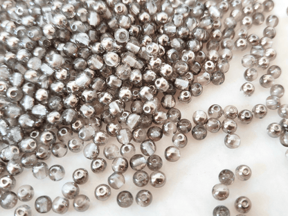 4mm runde Perlen - Farblos & Gunmetal