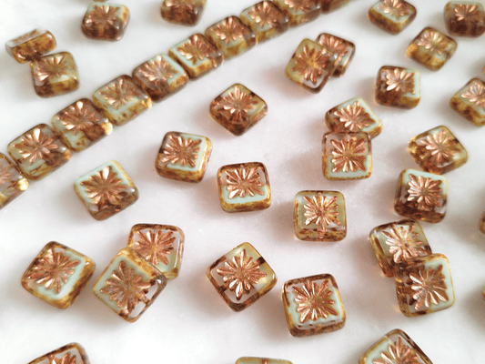 Quadratic kiwi ornament beads 10 mm - colorless & white Picasso