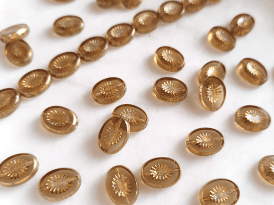 Oval kiwi ornament beads 14x10mm - colorless & gold