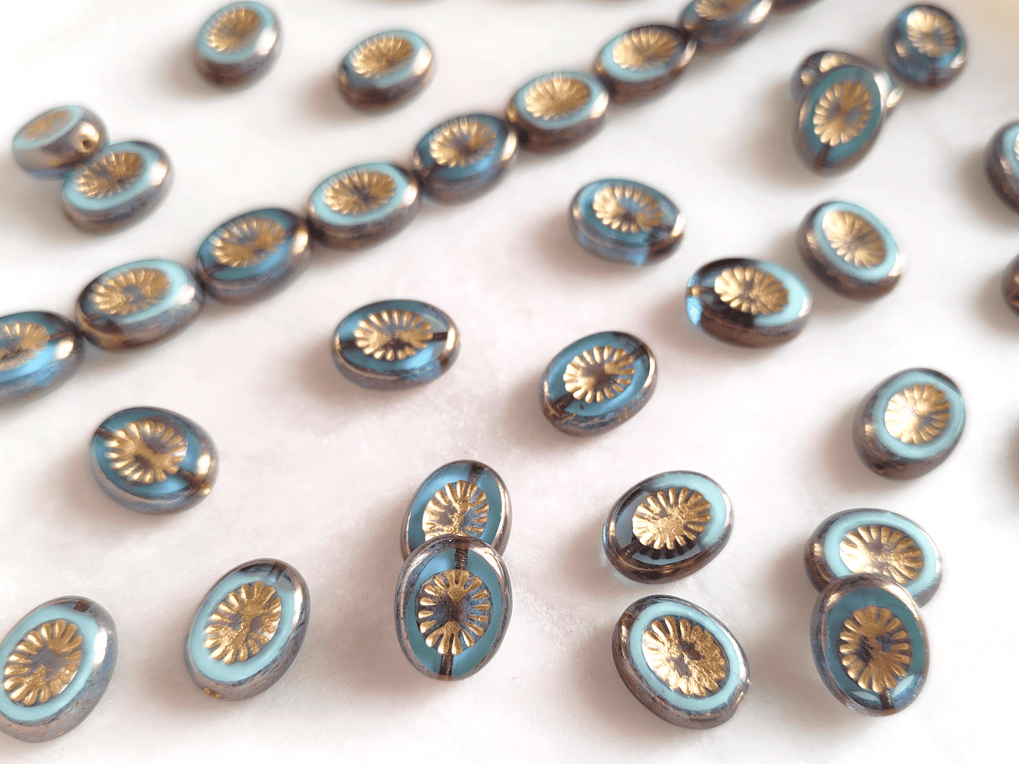 Oval kiwi ornament beads 14x10mm - light blue, purple & gold
