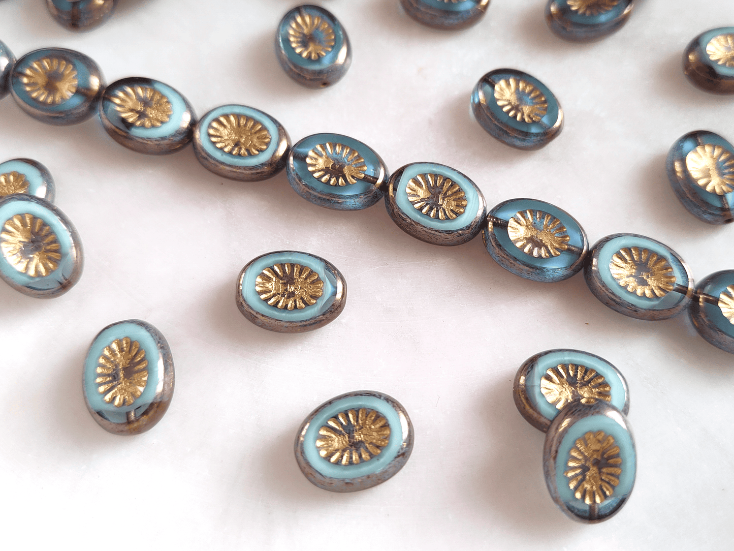 Oval kiwi ornament beads 14x10mm - light blue, purple & gold