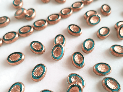 Oval kiwi ornament beads 14x10mm - blue & copper