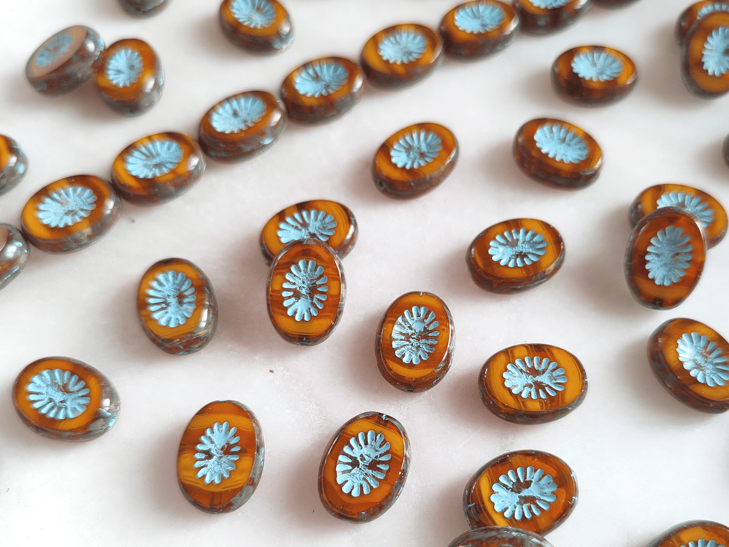 Oval kiwi ornament beads 14x10mm - amber & light blue