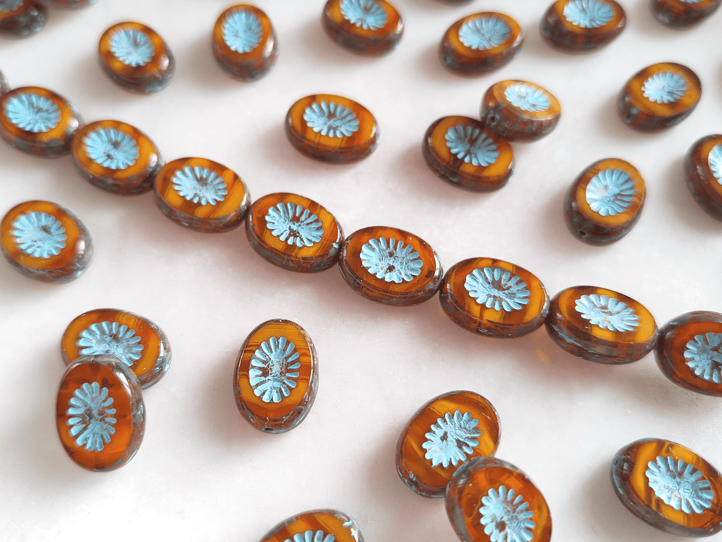 Oval kiwi ornament beads 14x10mm - amber & light blue